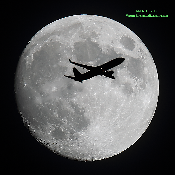 Jet Flying in Front of the Nearly Full Moon
